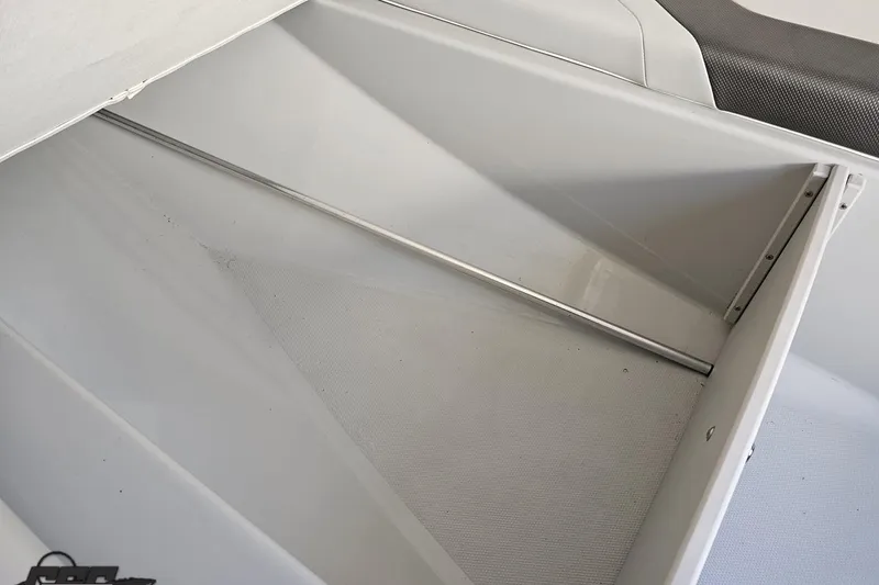 Slide: The Image of Storage compartment of a 2005 Baja 23 Outlaw boat, featuring clean, spacious interior. - 67