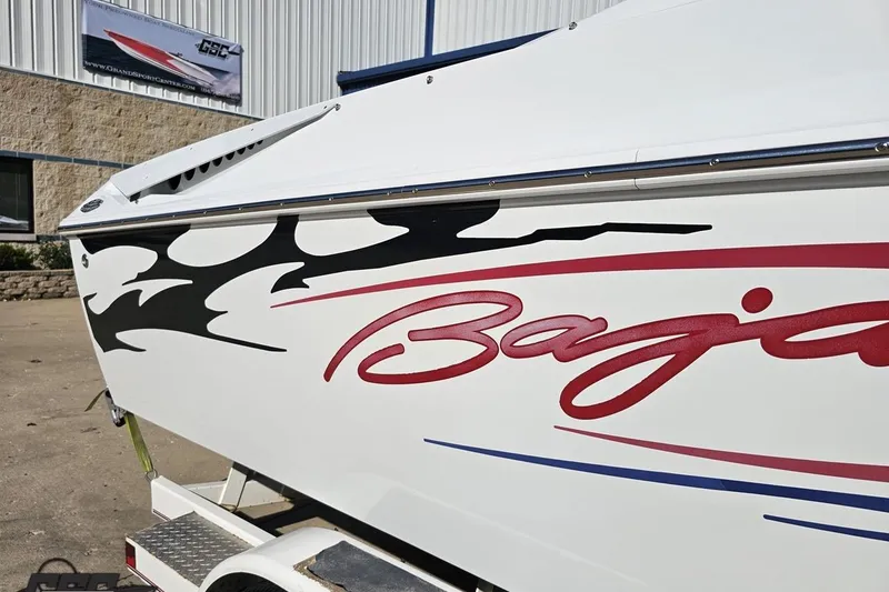 Slide: The Image of 2005 Baja 23 Outlaw boat with bold graphics and logo on the side. - 7