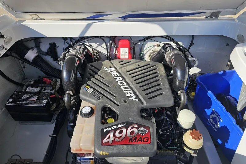 Slide: The Image of Engine compartment of a 2005 Baja 23 Outlaw boat with MerCruiser 496 MAG engine. - 79