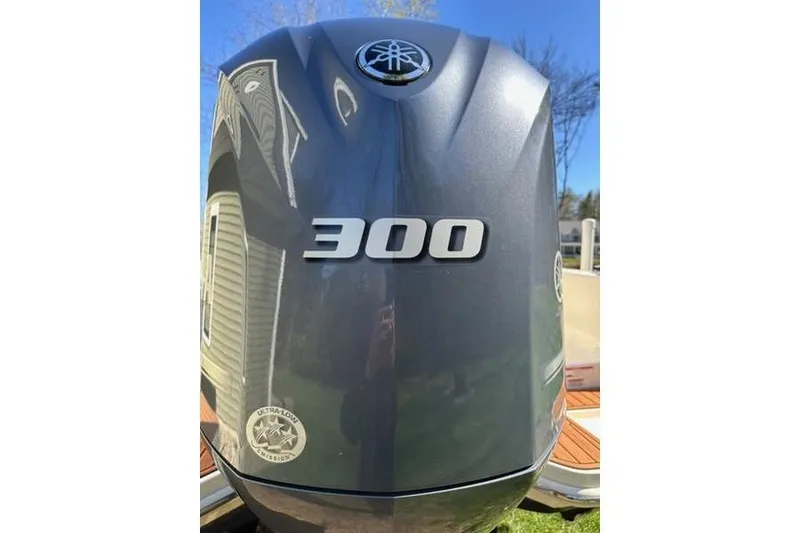 Slide: The Image of Yamaha 300 outboard motor on 2021 Scout 235 XSF boat, sunny day background. - 8