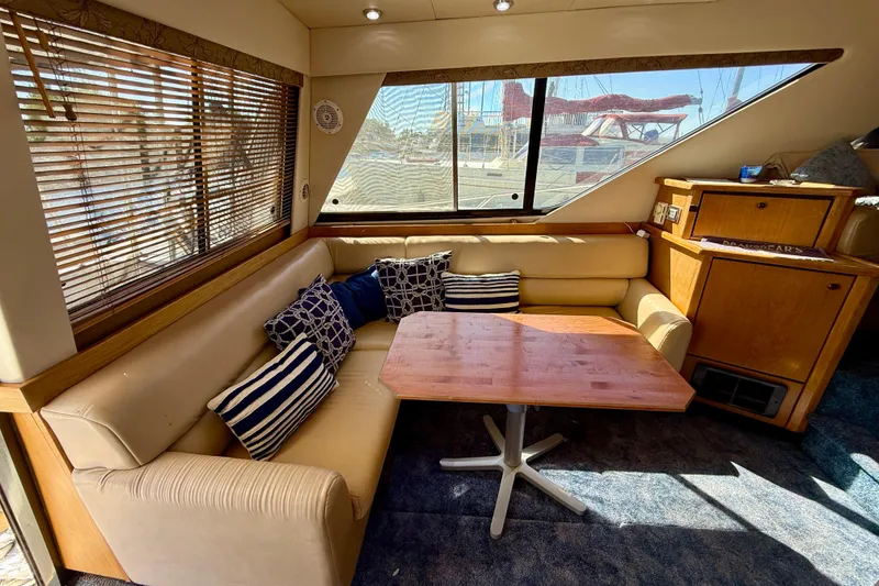 Slide: The Image of Luxurious interior of 1998 Bayliner 3988 Command Bridge Motoryacht with seating and kitchenette. - 15