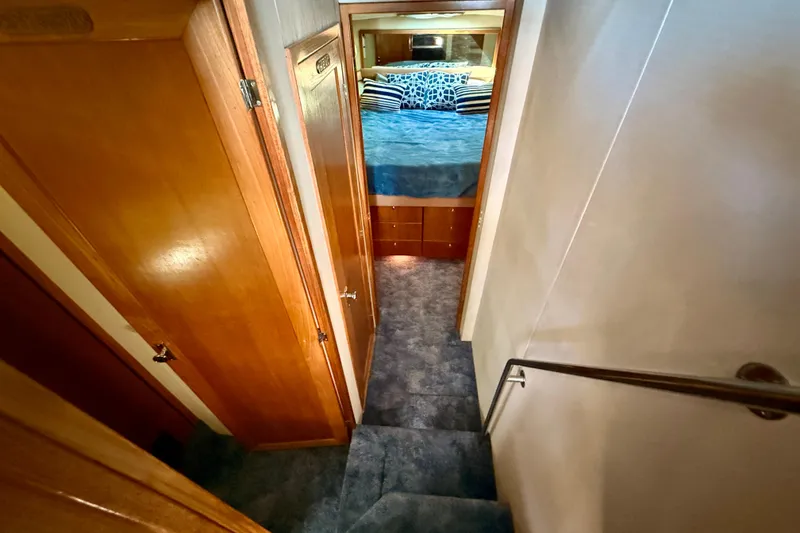 Slide: The Image of Interior of 1998 Bayliner 3988 Command Bridge Motoryacht with wood paneling and blue carpet. - 30