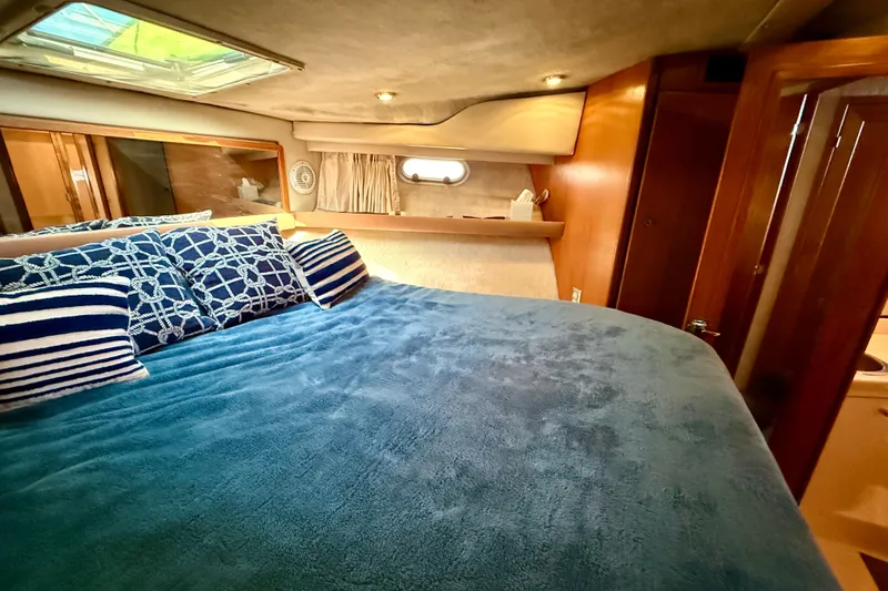 Slide: The Image of 1998 Bayliner 3988 Command Bridge Motoryacht bathroom with sink, toilet, and shower. - 36