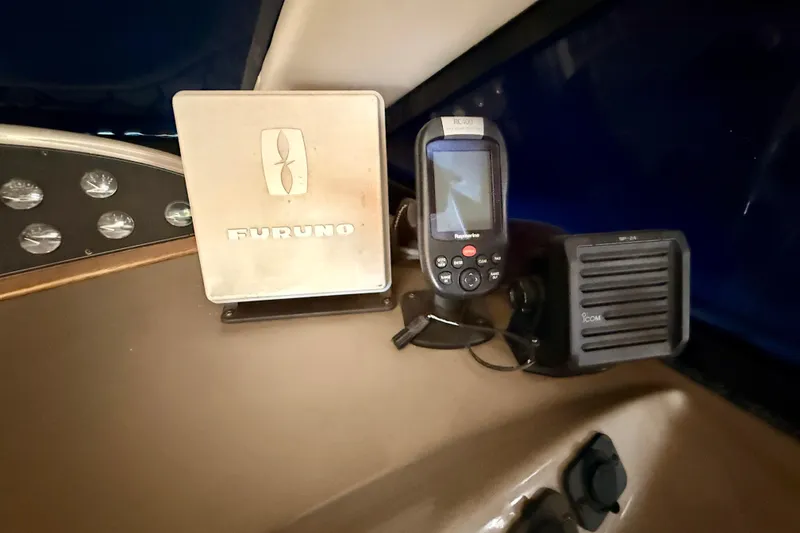 Slide: The Image of Cozy bedroom in 1998 Bayliner 3988 Command Bridge Motoryacht with blue bedding and wooden cabinetry. - 41