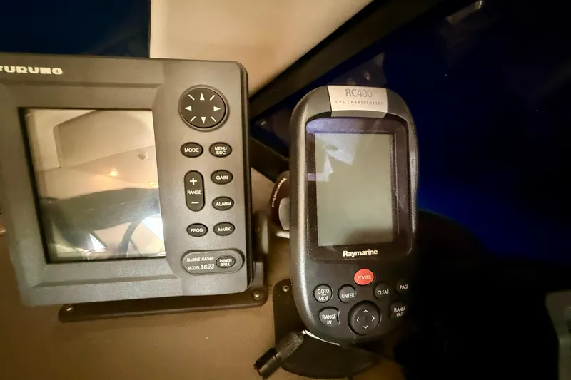 Slide: The Image of 1998 Bayliner 3988 Command Bridge Motoryacht bathroom with sink, toilet, and mirror. - 42