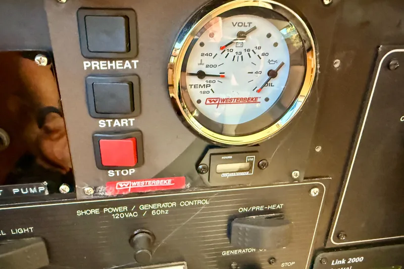Slide: The Image of 1998 Bayliner 3988 Command Bridge Motoryacht dashboard with Furuno and Icom navigation equipment. - 43