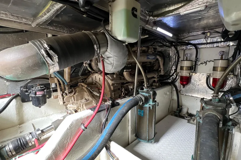 Slide: The Image of Engine room of 1998 Bayliner 3988 Command Bridge Motoryacht, showcasing mechanical components. - 50