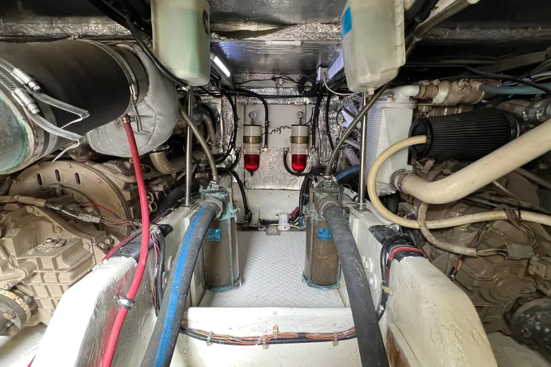 Slide: The Image of Engine room of 1998 Bayliner 3988 Command Bridge Motoryacht, showcasing mechanical components. - 51