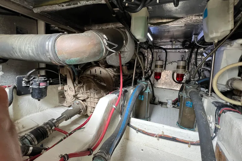 Slide: The Image of Engine room of 1998 Bayliner 3988 Command Bridge Motoryacht, showcasing mechanical components. - 56