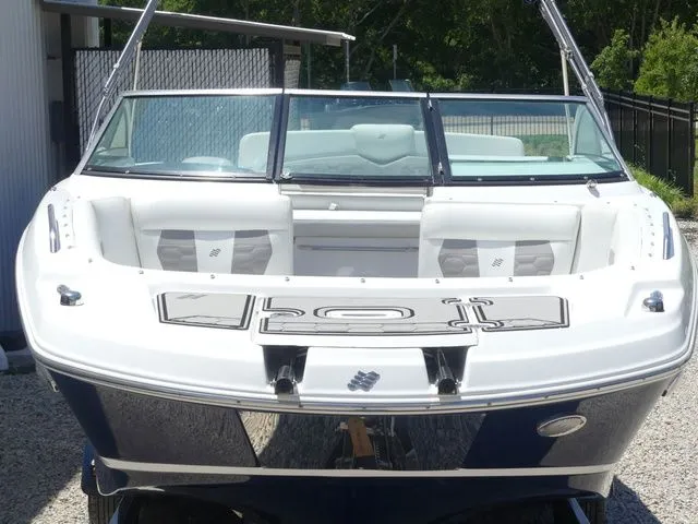 Slide: The Image of 2021 Four Winns HD3 boat, front view, parked on a trailer. - 17