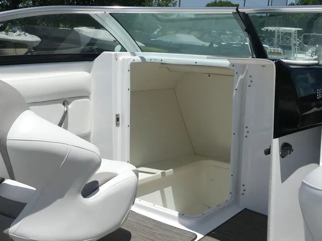 Slide: The Image of Interior of 2021 Four Winns HD3 boat featuring storage compartment. - 27