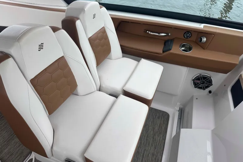 Slide: The Image of 2019 Four Winns H350 OB boat interior with brown and white seating. - 18