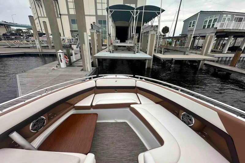 Slide: The Image of 2019 Four Winns H350 OB boat interior at a marina dock. - 20