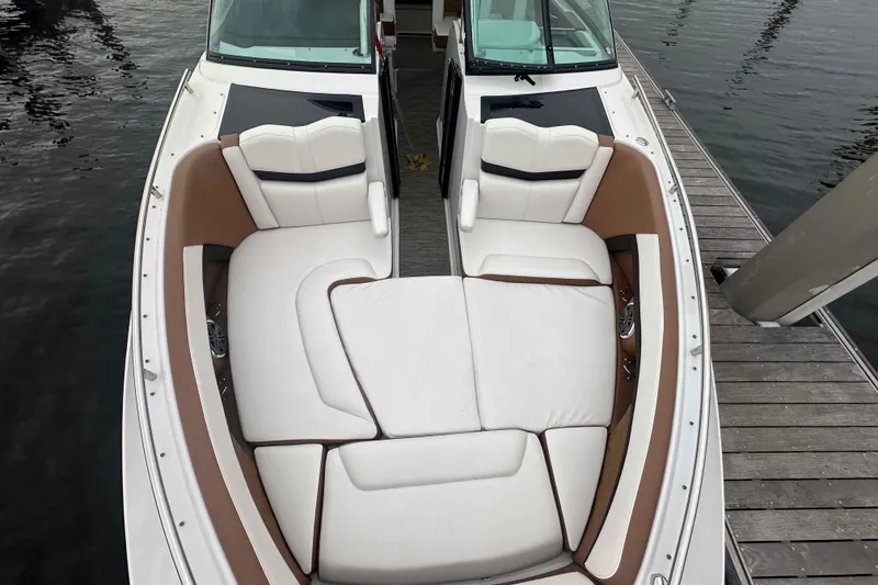 Slide: The Image of 2019 Four Winns H350 OB boat with spacious seating at dockside. - 22
