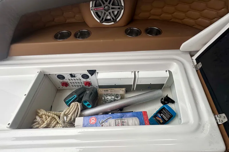Slide: The Image of Storage compartment of 2019 Four Winns H350 OB boat with ropes and accessories. - 37