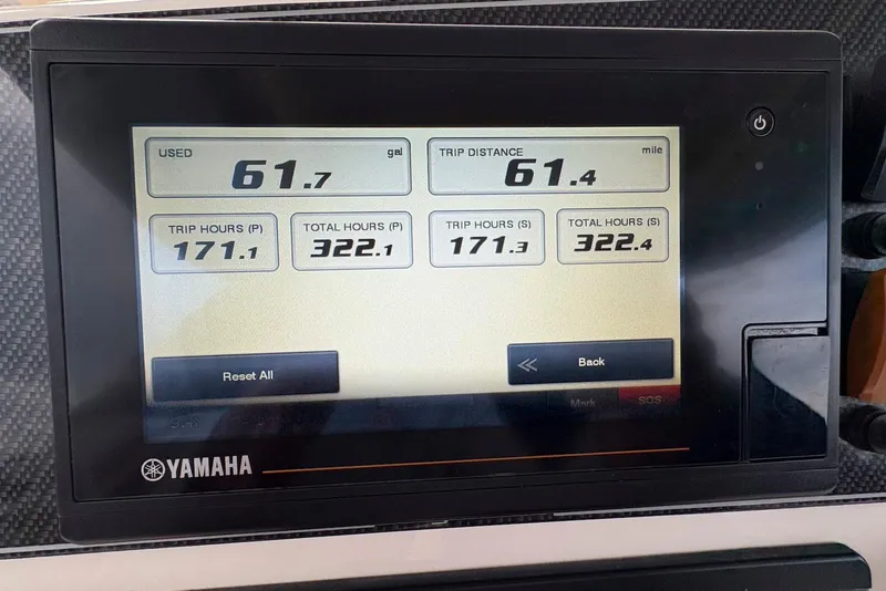 Slide: The Image of 2020 Grady-White Canyon 306 boat docked at marina under blue sky. - 10