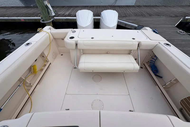 Slide: The Image of 2020 Grady-White Canyon 306 boat interior with steering wheel and seating. - 14