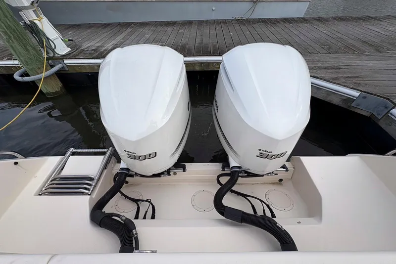 Slide: The Image of 2020 Grady-White Canyon 306 boat dashboard with steering wheel and electronic controls. - 15