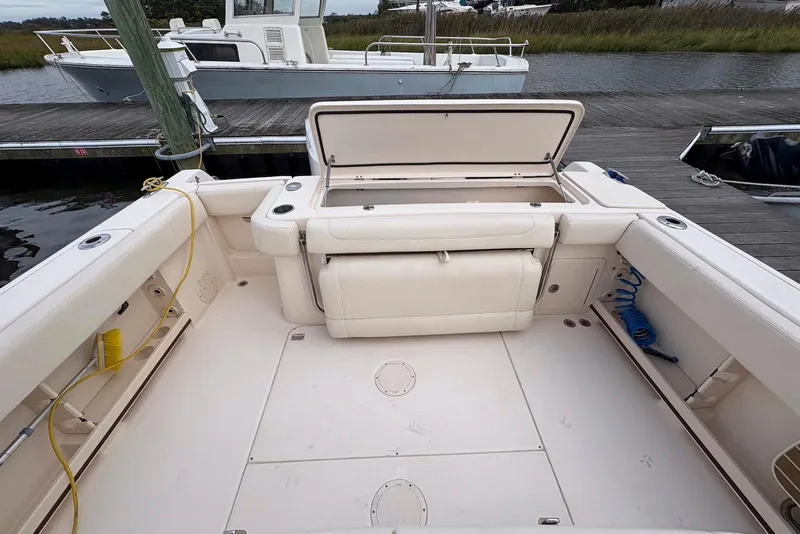 Slide: The Image of 2020 Grady-White Canyon 306 boat helm with modern controls and steering wheel. - 16