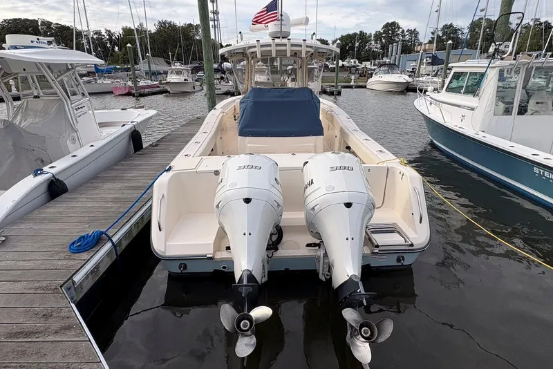 Slide: The Image of 2020 Grady-White Canyon 306 boat docked with Yamaha engines. - 2