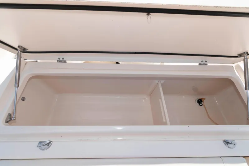 Slide: The Image of Open storage compartment on 2020 Grady-White Canyon 306 boat. - 23