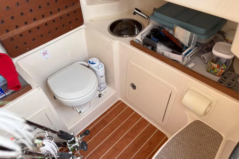 Slide: The Image of 2020 Grady-White Canyon 306 boat docked, showcasing brand logo and sleek design. - 5