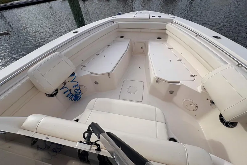 Slide: The Image of 2020 Grady-White Canyon 306 boat interior with seating, docked at marina. - 6