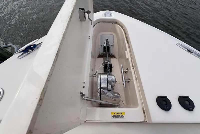 Slide: The Image of 2020 Grady-White Canyon 306 boat docked, showcasing spacious seating and helm area. - 7