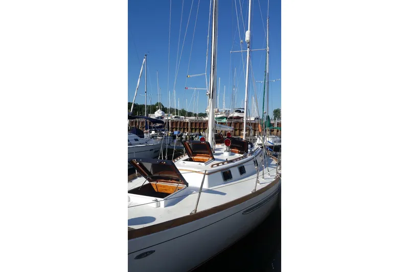 Slide: The Image of 1977 Cheoy Lee Offshore 41 ketch docked at marina, clear blue sky. - 3