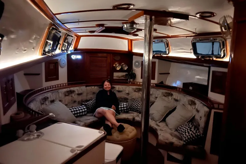 Slide: The Image of Interior of 1977 Cheoy Lee Offshore 41 ketch with cozy seating and wooden accents. - 5