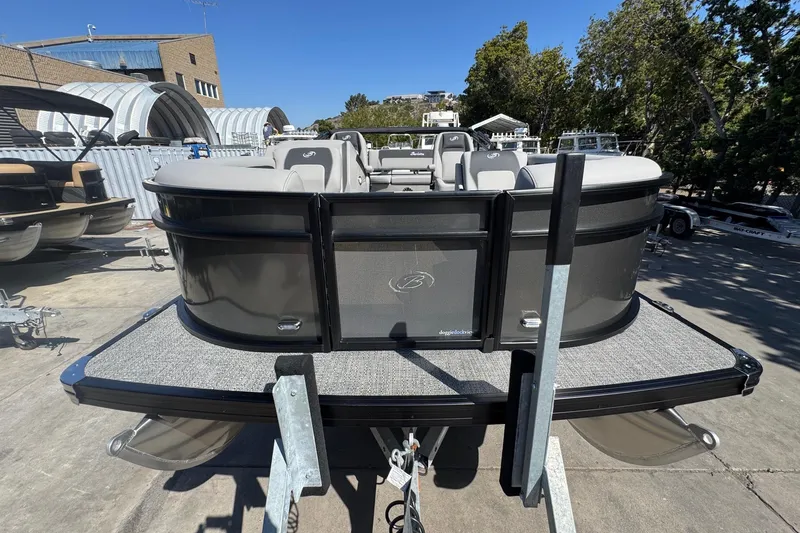 Slide: The Image of 2026 Barletta ARIA 22UC pontoon boat on trailer, outdoor setting. - 18