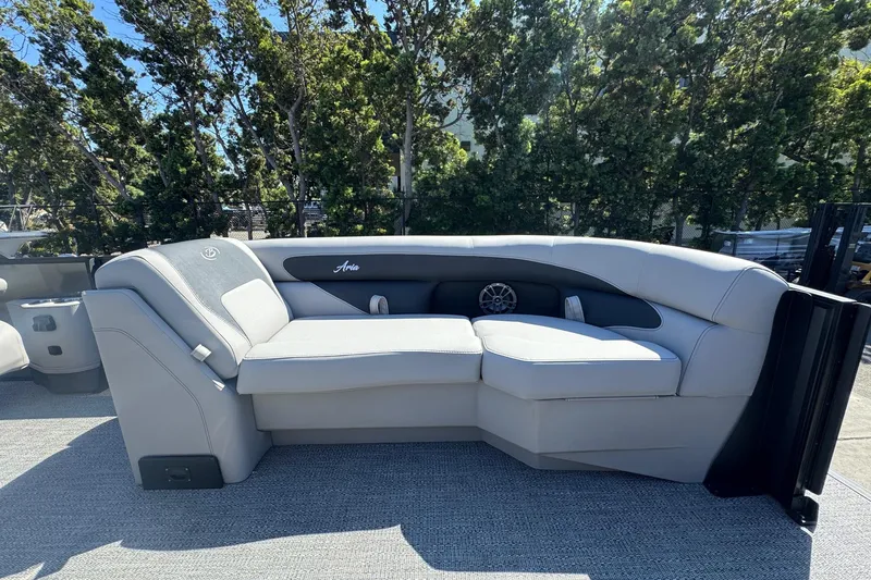 Slide: The Image of Luxurious seating on 2026 Barletta ARIA 22UC pontoon boat, surrounded by lush greenery. - 20