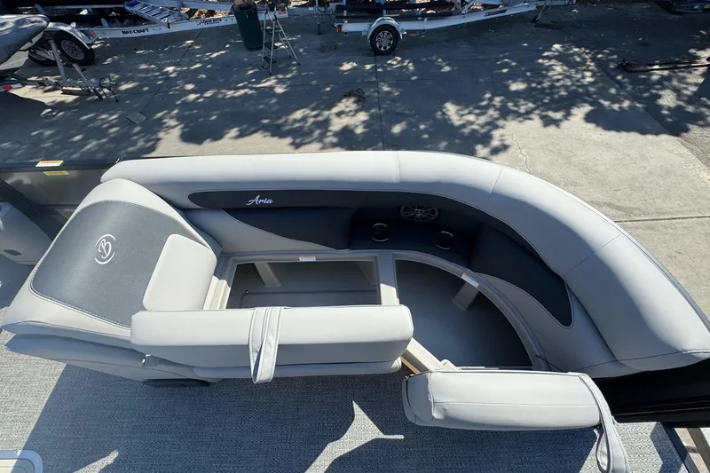 Slide: The Image of 2026 Barletta ARIA 22UC pontoon boat interior with gray seating and cup holders. - 22