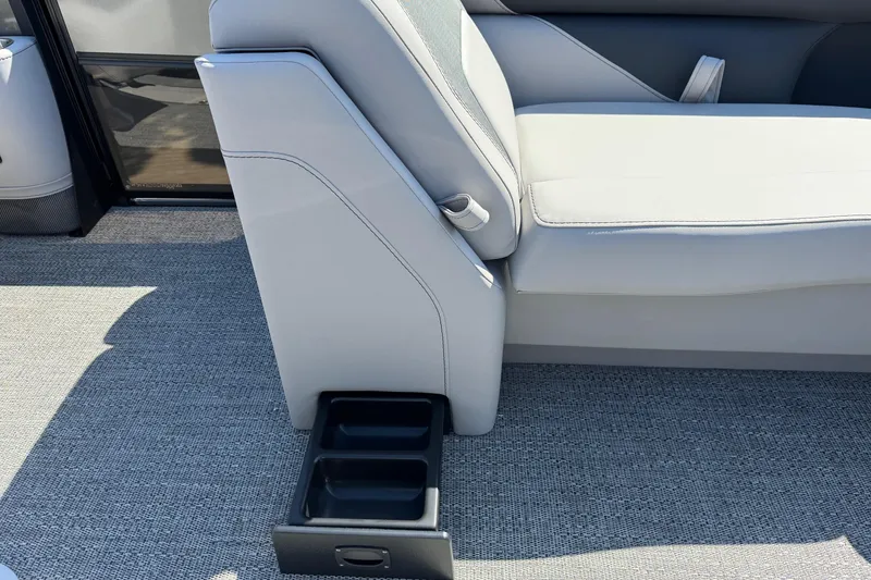Slide: The Image of 2026 Barletta ARIA 22UC boat interior with gray seating and built-in cup holders. - 27