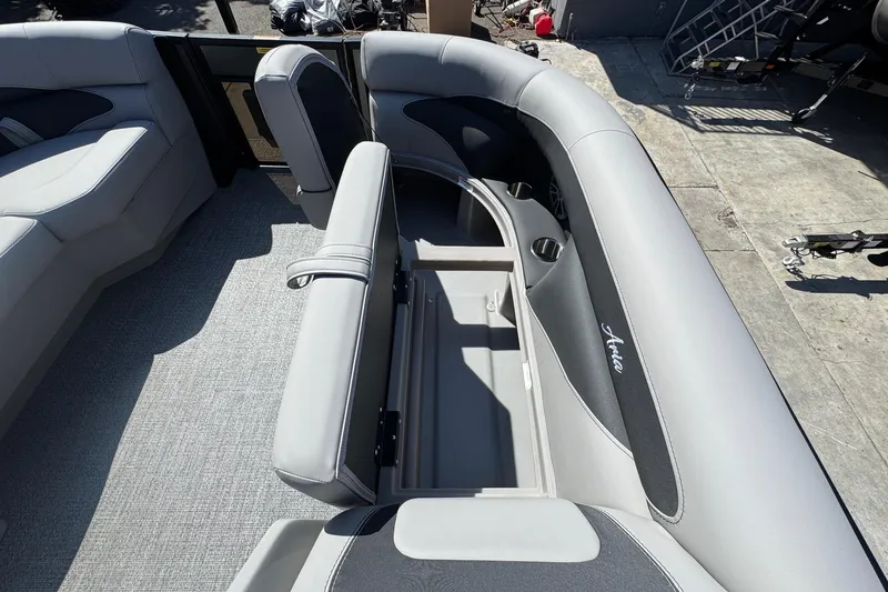 Slide: The Image of 2026 Barletta ARIA 22UC boat interior with open storage compartment and cushioned seating. - 30