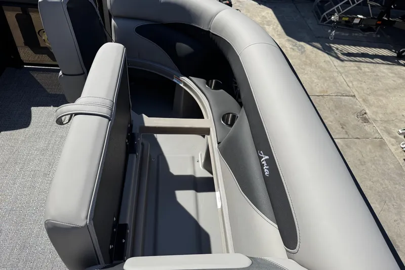 Slide: The Image of 2026 Barletta ARIA 22UC boat interior with gray seating and storage compartment. - 31