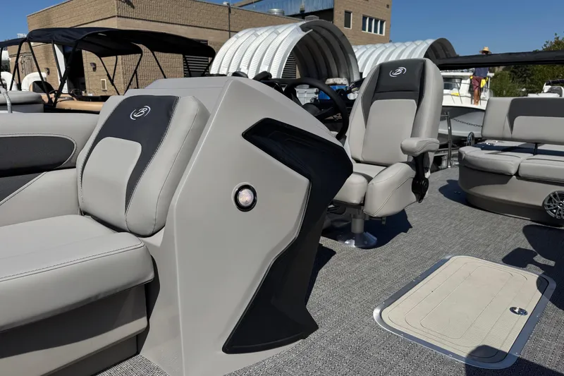 Slide: The Image of 2026 Barletta ARIA 22UC boat interior with modern seating and steering console. - 33