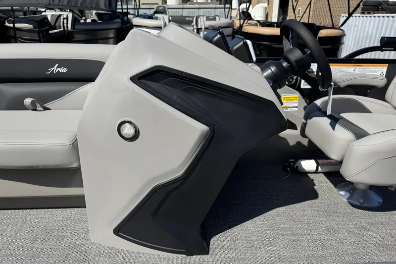 Slide: The Image of 2026 Barletta ARIA 22UC boat interior with steering wheel and seating. - 34