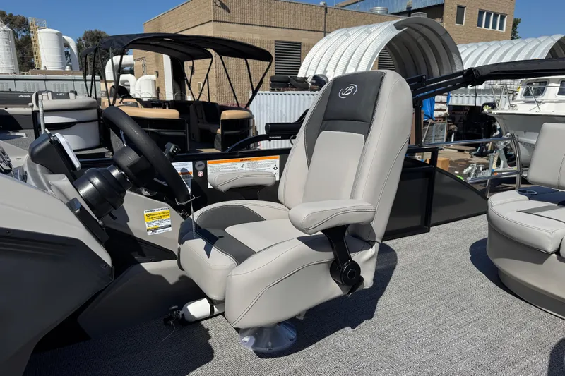 Slide: The Image of 2026 Barletta ARIA 22UC boat interior with captain's chair and steering wheel. - 35