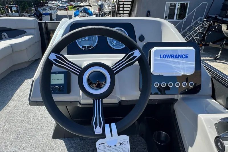 Slide: The Image of Steering console of 2026 Barletta ARIA 22UC boat with Lowrance display and gauges. - 41