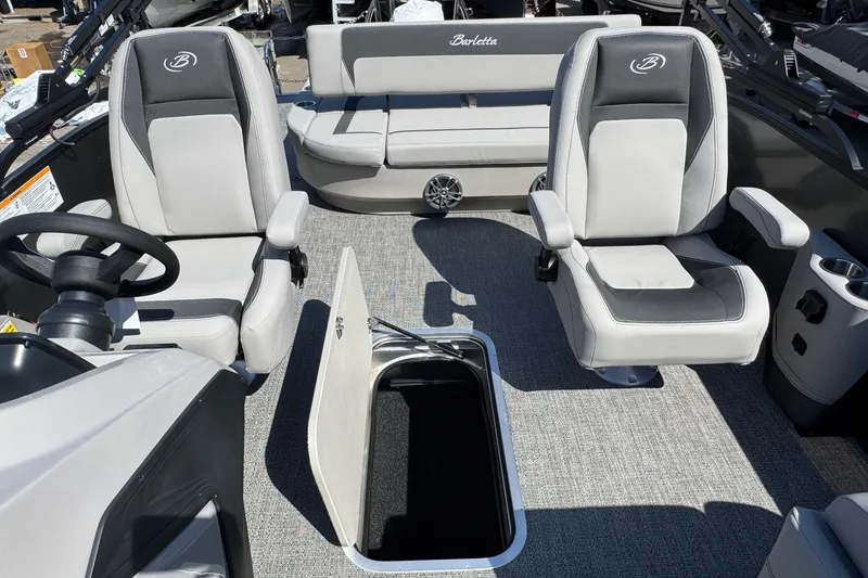 Slide: The Image of 2026 Barletta ARIA 22UC boat interior with plush seating and storage compartment. - 46
