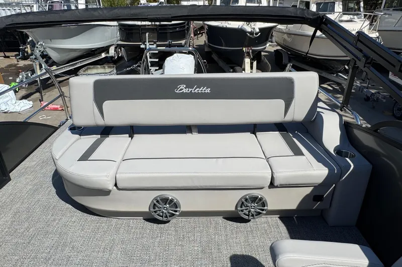 Slide: The Image of 2026 Barletta ARIA 22UC boat interior with gray seating and cup holders. - 50
