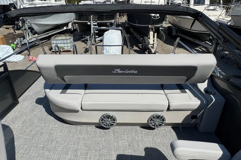 Slide: The Image of 2026 Barletta ARIA 22UC boat interior with gray seating and speaker system. - 51