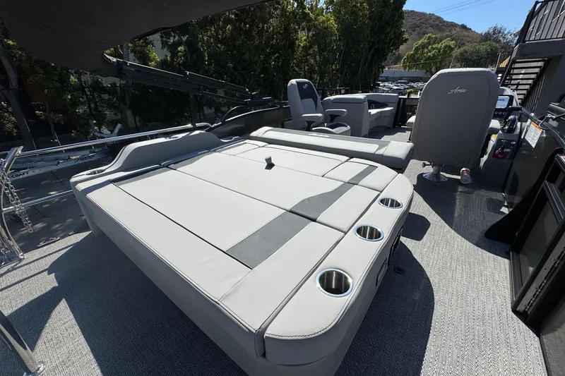 Slide: The Image of 2026 Barletta ARIA 22UC pontoon boat interior with spacious seating and cup holders. - 54