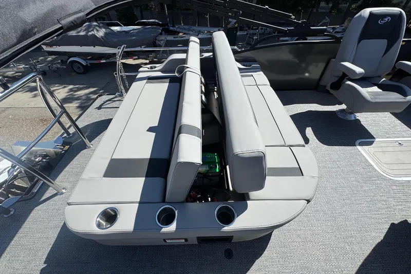 Slide: The Image of 2026 Barletta ARIA 22UC pontoon boat interior with gray seating and cup holders. - 56
