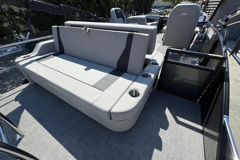 Slide: The Image of 2026 Barletta ARIA 22UC boat interior with gray seating and cup holders. - 58