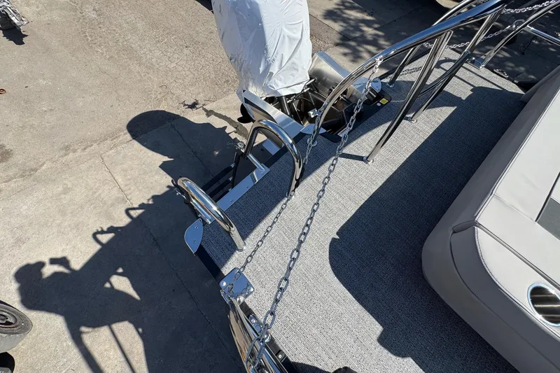 Slide: The Image of 2026 Barletta ARIA 22UC boat deck with chrome railings and seating. - 60