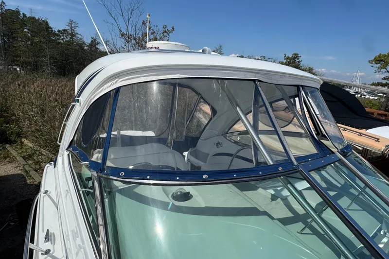 Slide: The Image of 2011 Formula 37 Performance Cruiser with clear canopy, docked outdoors on a sunny day. - 11