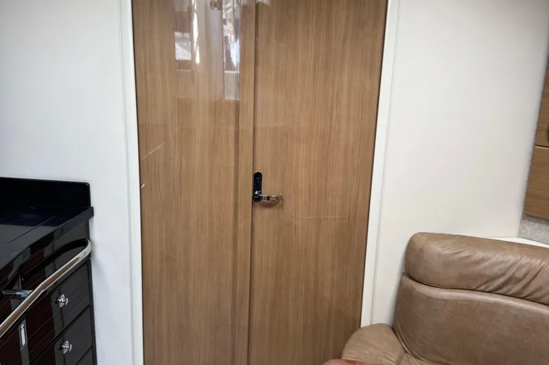 Slide: The Image of Interior of 2011 Formula 37 Performance Cruiser with wooden door and leather seating. - 17