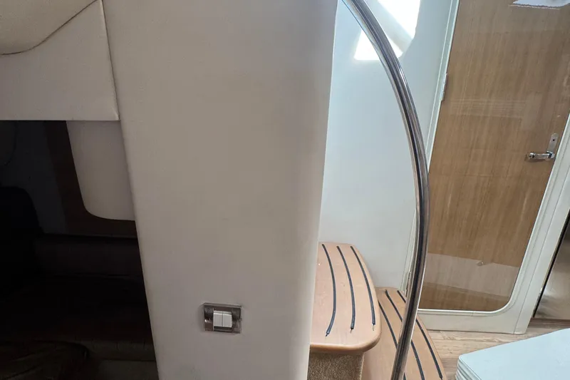 Slide: The Image of Interior of 2011 Formula 37 Performance Cruiser, featuring stairs and a wooden door. - 21